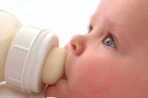 Close up of baby drinking his bottle