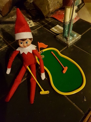 elf having a game of mini golf