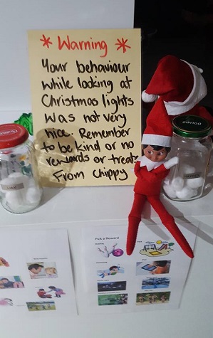 elf on the shelf warns the kids to behave